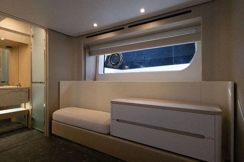  Yacht Photos Pics Luxurious interior of 2025 Azimut Fly 68 yacht with modern furnishings and window view.