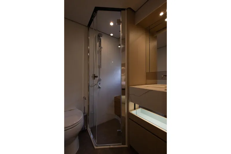  Yacht Photos Pics Luxurious bathroom in 2025 Azimut Fly 68 yacht with modern shower and sleek design.