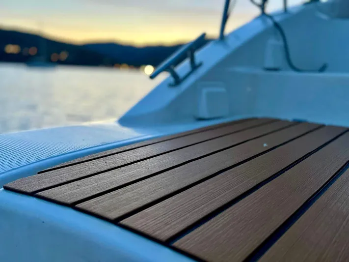  Yacht Photos Pics Close-up of 2005 Fountaine Pajot LAVEZZI 40 deck at sunset, overlooking calm waters.