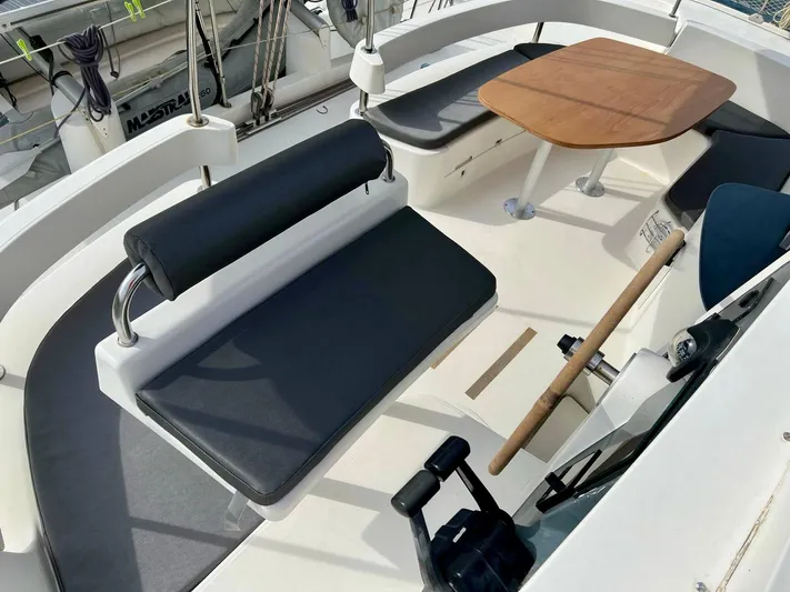  Yacht Photos Pics 2005 Fountaine Pajot LAVEZZI 40 catamaran cockpit with seating and wooden table.