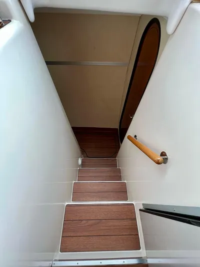  Yacht Photos Pics Staircase inside 2005 Fountaine Pajot LAVEZZI 40 catamaran with wooden steps and handrail.
