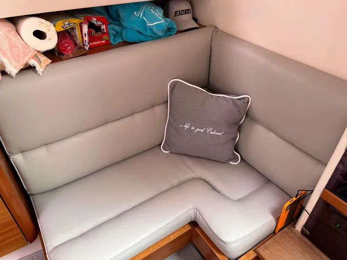 Reckless Yacht Photos Pics Cozy seating area in 2012 Fjord 40 Open yacht with decorative pillow.