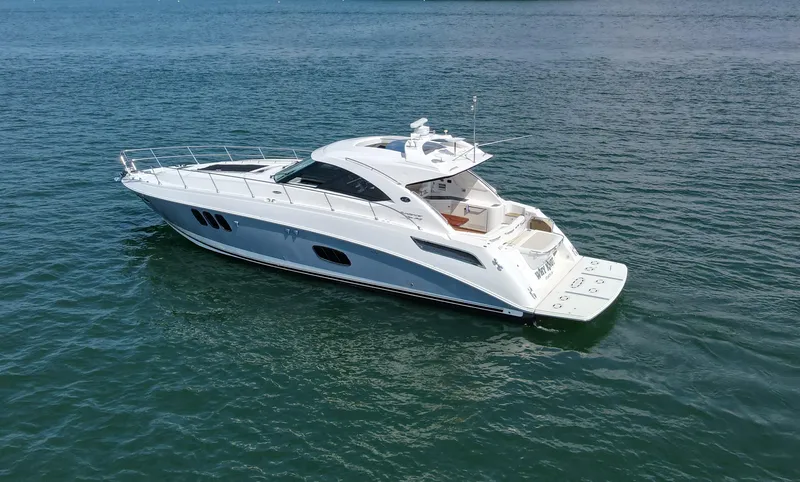 Why Knot Yacht Photos Pics 2012 Sea Ray 540 Sundancer yacht cruising on open water.