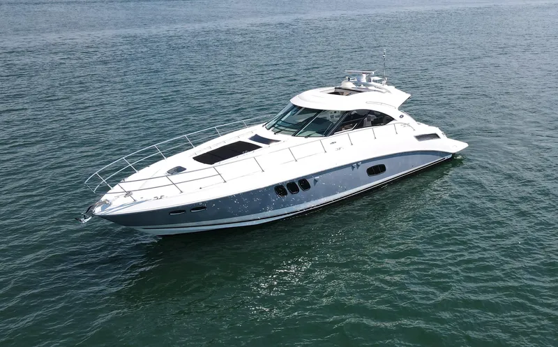 Why Knot Yacht Photos Pics 2012 Sea Ray 540 Sundancer yacht cruising on open water.