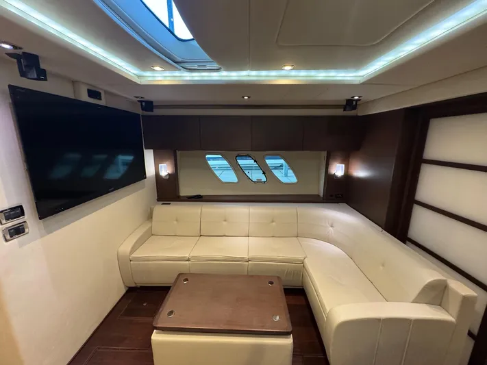 Why Knot Yacht Photos Pics Luxurious interior of 2012 Sea Ray 540 Sundancer yacht with plush seating and modern design.