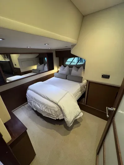 Why Knot Yacht Photos Pics Luxurious bedroom interior of 2012 Sea Ray 540 Sundancer yacht with cozy bedding.