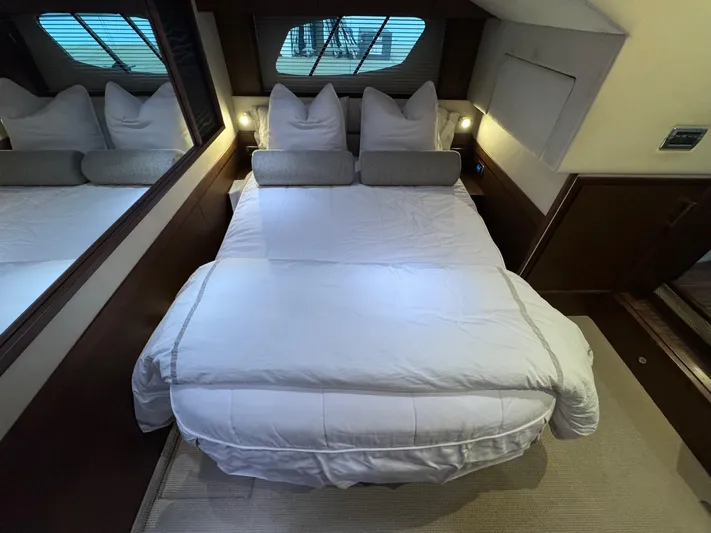 Why Knot Yacht Photos Pics Luxurious bedroom interior of 2012 Sea Ray 540 Sundancer yacht with cozy bedding.