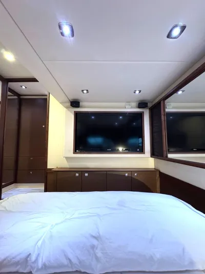 Why Knot Yacht Photos Pics Luxurious interior of 2012 Sea Ray 540 Sundancer yacht with TV and modern lighting.