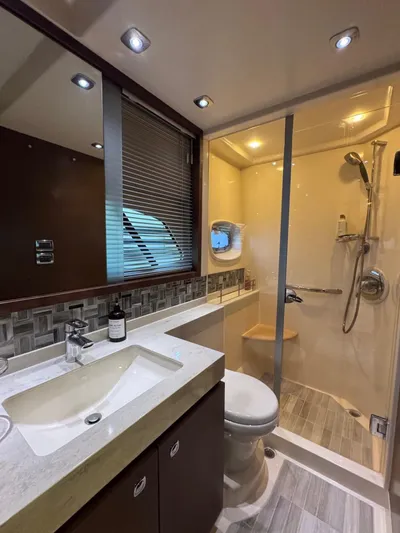 Why Knot Yacht Photos Pics Luxurious bathroom in 2012 Sea Ray 540 Sundancer yacht with modern fixtures and shower.