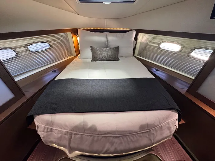 Why Knot Yacht Photos Pics Luxurious bedroom interior of 2012 Sea Ray 540 Sundancer yacht with elegant bedding.