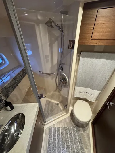 Why Knot Yacht Photos Pics Luxurious bathroom in 2012 Sea Ray 540 Sundancer yacht with shower and modern fixtures.