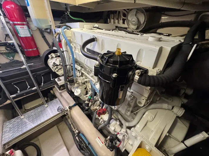 Why Knot Yacht Photos Pics Engine room of 2012 Sea Ray 540 Sundancer yacht, featuring detailed mechanical components.