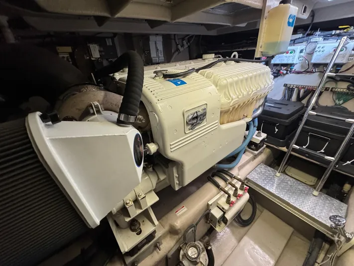 Why Knot Yacht Photos Pics Engine room of 2012 Sea Ray 540 Sundancer yacht, showcasing detailed machinery and components.