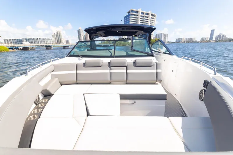  Yacht Photos Pics 2022 New Cruiser Yachts GLS 38, luxury boat interior with waterfront cityscape.
