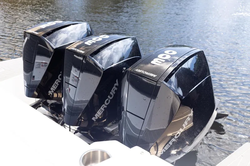  Yacht Photos Pics Triple Mercury outboard engines on 2022 New Cruiser Yachts GLS 38, docked on water.
