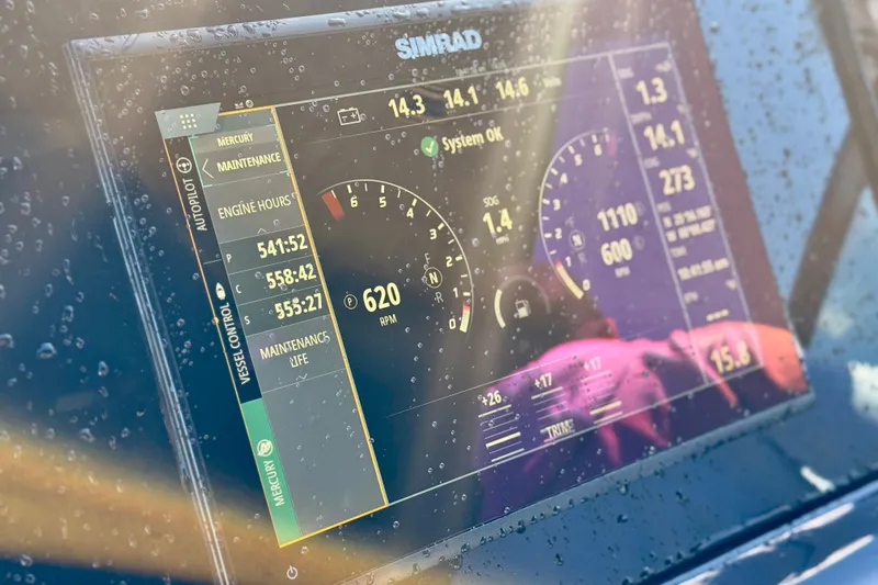  Yacht Photos Pics Simrad display on 2022 New Cruiser Yachts GLS 38, showing engine metrics and maintenance data.