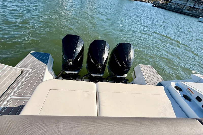  Yacht Photos Pics 2022 New Cruiser Yachts GLS 38 with triple Mercury outboard engines on water.