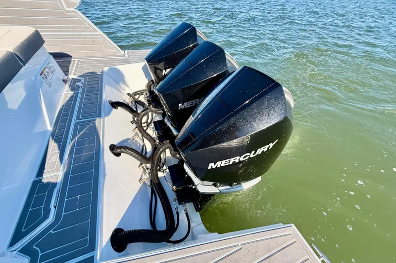  Yacht Photos Pics Triple Mercury outboard engines on 2022 New Cruiser Yachts GLS 38 in water.