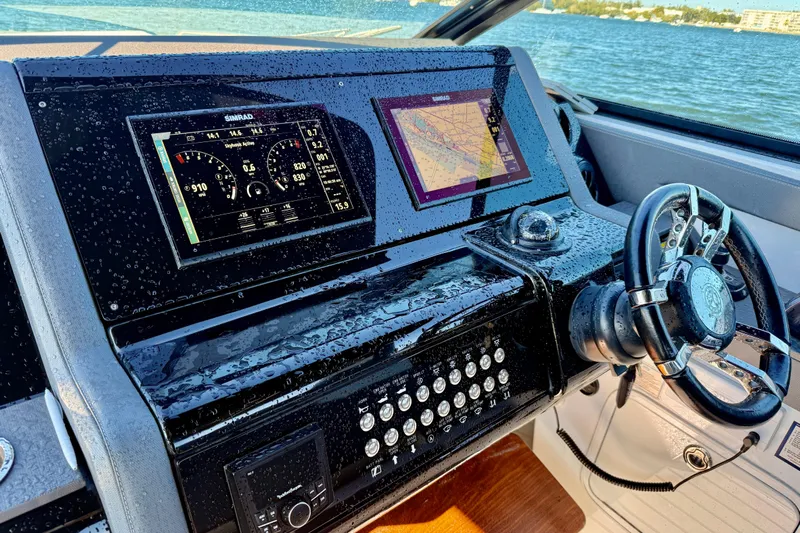  Yacht Photos Pics Helm of 2022 New Cruiser Yachts GLS 38 with navigation screens and steering wheel.