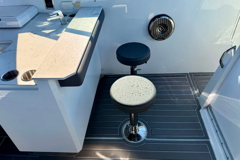  Yacht Photos Pics 2022 New Cruiser Yachts GLS 38 interior with bar stools and sleek design.