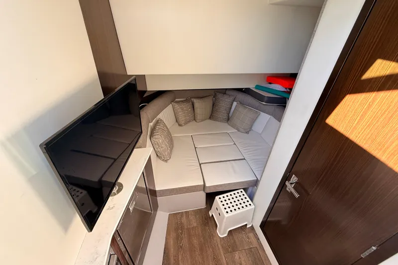  Yacht Photos Pics Interior of 2022 New Cruiser Yachts GLS 38, featuring cozy seating and a TV.