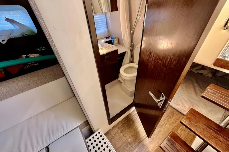  Yacht Photos Pics Interior of 2022 New Cruiser Yachts GLS 38, featuring a compact bathroom and cozy cabin space.