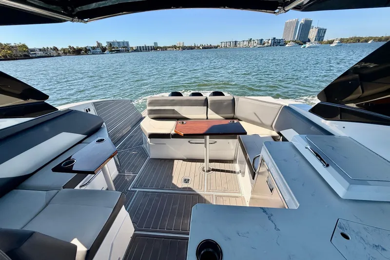  Yacht Photos Pics Luxurious 2022 New Cruiser Yachts GLS 38 interior with elegant seating and scenic water view.
