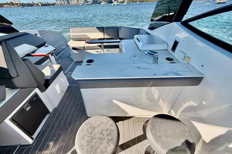  Yacht Photos Pics Luxury interior of 2022 New Cruiser Yachts GLS 38 with seating and kitchenette.