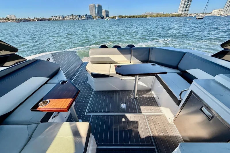  Yacht Photos Pics Luxurious 2022 New Cruiser Yachts GLS 38 with spacious seating and scenic waterfront view.