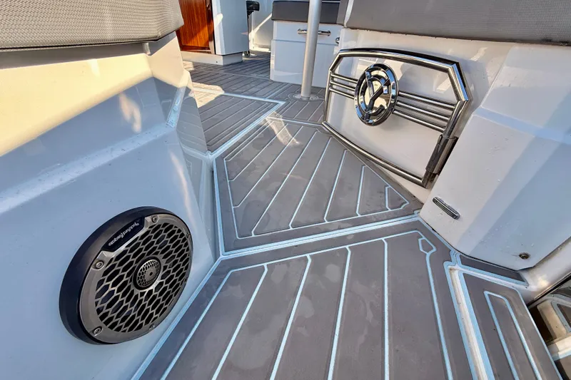  Yacht Photos Pics 2022 New Cruiser Yachts GLS 38 interior with sleek flooring and speaker detail.