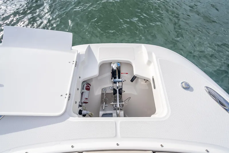 Trade In-- Bring All Offers & Trades Yacht Photos Pics 2024 Boston Whaler 320 Vantage anchor compartment, open on calm water.