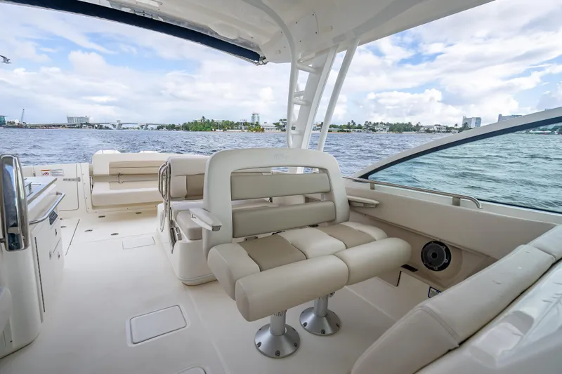 Trade In-- Bring All Offers & Trades Yacht Photos Pics 2024 Boston Whaler 320 Vantage interior with seating, ocean view, and modern design.