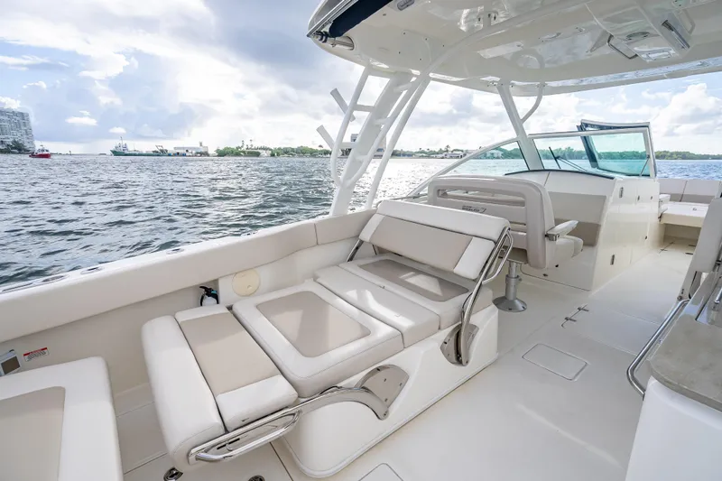 Trade In-- Bring All Offers & Trades Yacht Photos Pics 2024 Boston Whaler 320 Vantage boat interior with luxurious seating and ocean view.