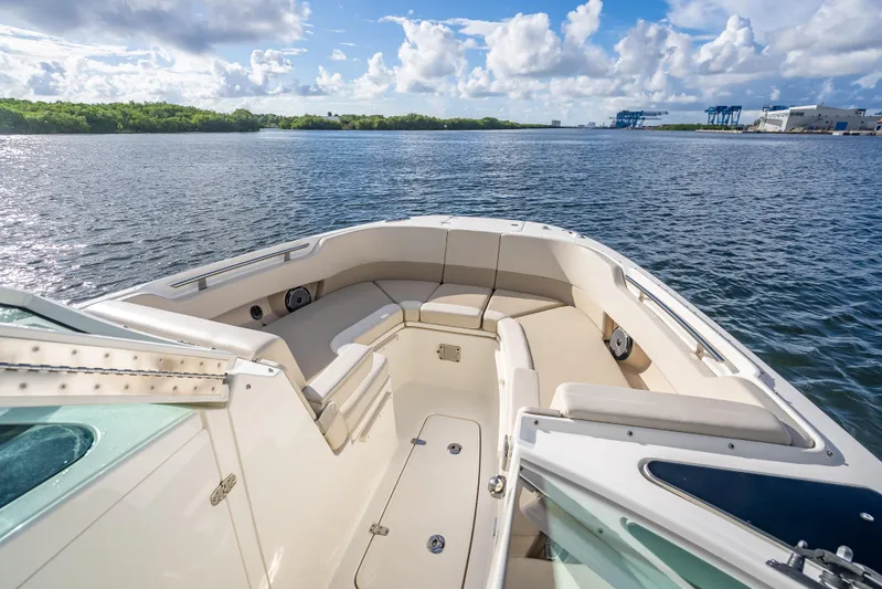 Trade In-- Bring All Offers & Trades Yacht Photos Pics 2024 Boston Whaler 320 Vantage boat interior with spacious seating, overlooking calm waters.