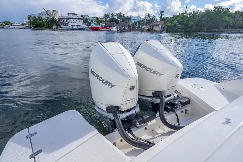 Trade In-- Bring All Offers & Trades Yacht Photos Pics 2024 Boston Whaler 320 Vantage with twin Mercury outboard engines on water.