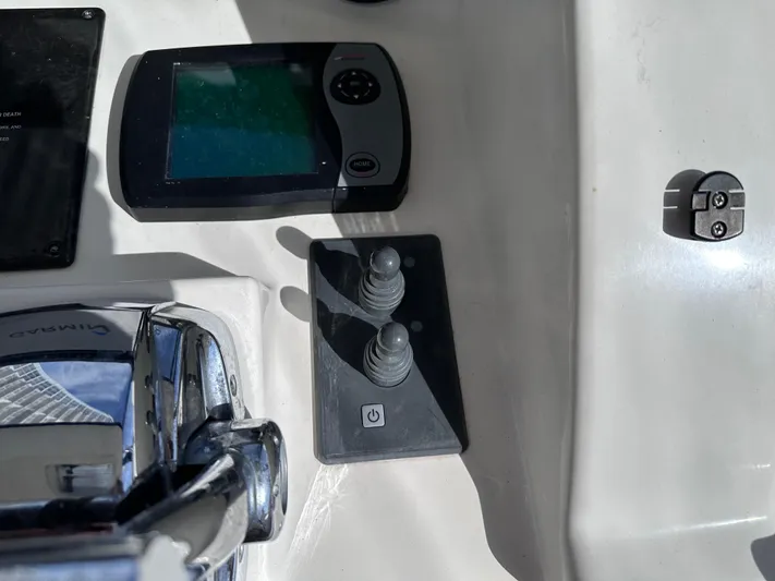  Yacht Photos Pics Control console of 2007 Sea Ray 36 Sedan Bridge with joysticks and display.