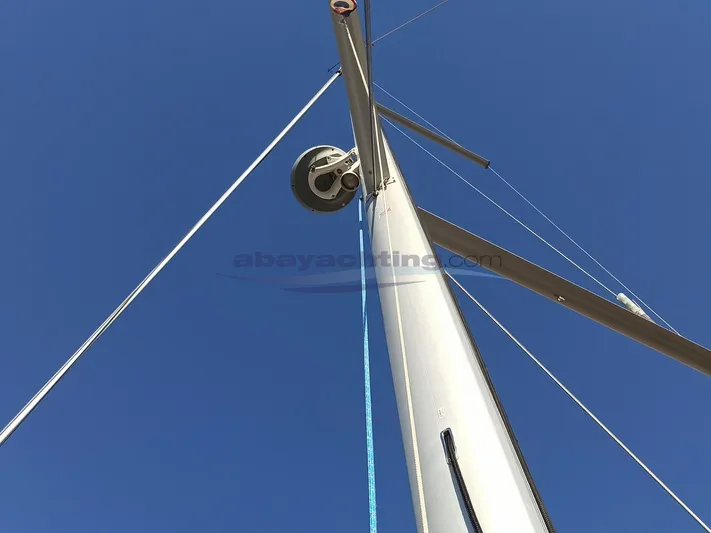  Yacht Photos Pics Mast of 2016 Beneteau Oceanis 45 sailboat against clear blue sky.