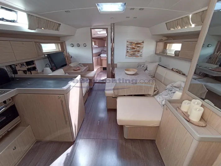  Yacht Photos Pics Luxurious interior of 2016 Beneteau Oceanis 45 yacht with modern furnishings and ample natural light.