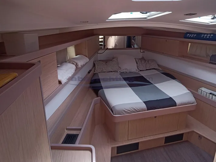  Yacht Photos Pics Luxurious interior cabin of 2016 Beneteau Oceanis 45 yacht with cozy bed and modern design.