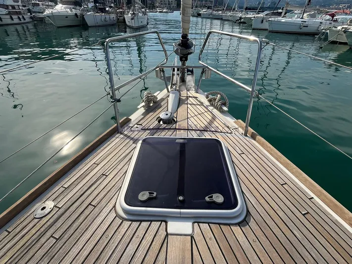  Yacht Photos Pics Deck view of a 2016 Beneteau Oceanis 45 yacht in a marina.