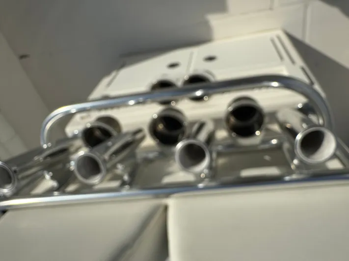 25 Regulator In Stock Yacht Photos Pics Blurred view of a 2018 Regulator 25 boat's rod holders and storage compartment.