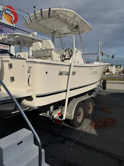 25 Regulator In Stock Yacht Photos Pics 2018 Regulator 25 boat on trailer, parked outdoors under cloudy sky.