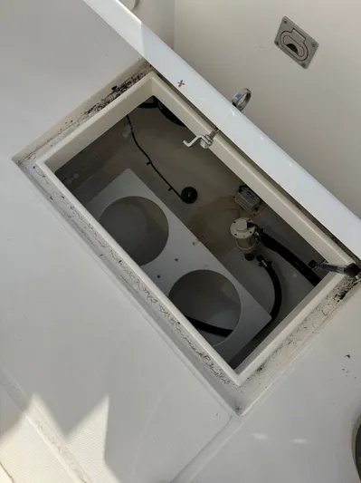 25 Regulator In Stock Yacht Photos Pics Open storage compartment on a 2018 Regulator 25 boat, showing internal components.