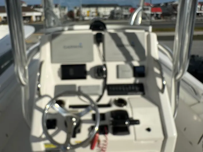 25 Regulator In Stock Yacht Photos Pics 2018 Regulator 25 boat console with steering wheel and navigation equipment.