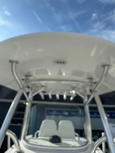 25 Regulator In Stock Yacht Photos Pics 2018 Regulator 25 boat with T-top under a clear blue sky.