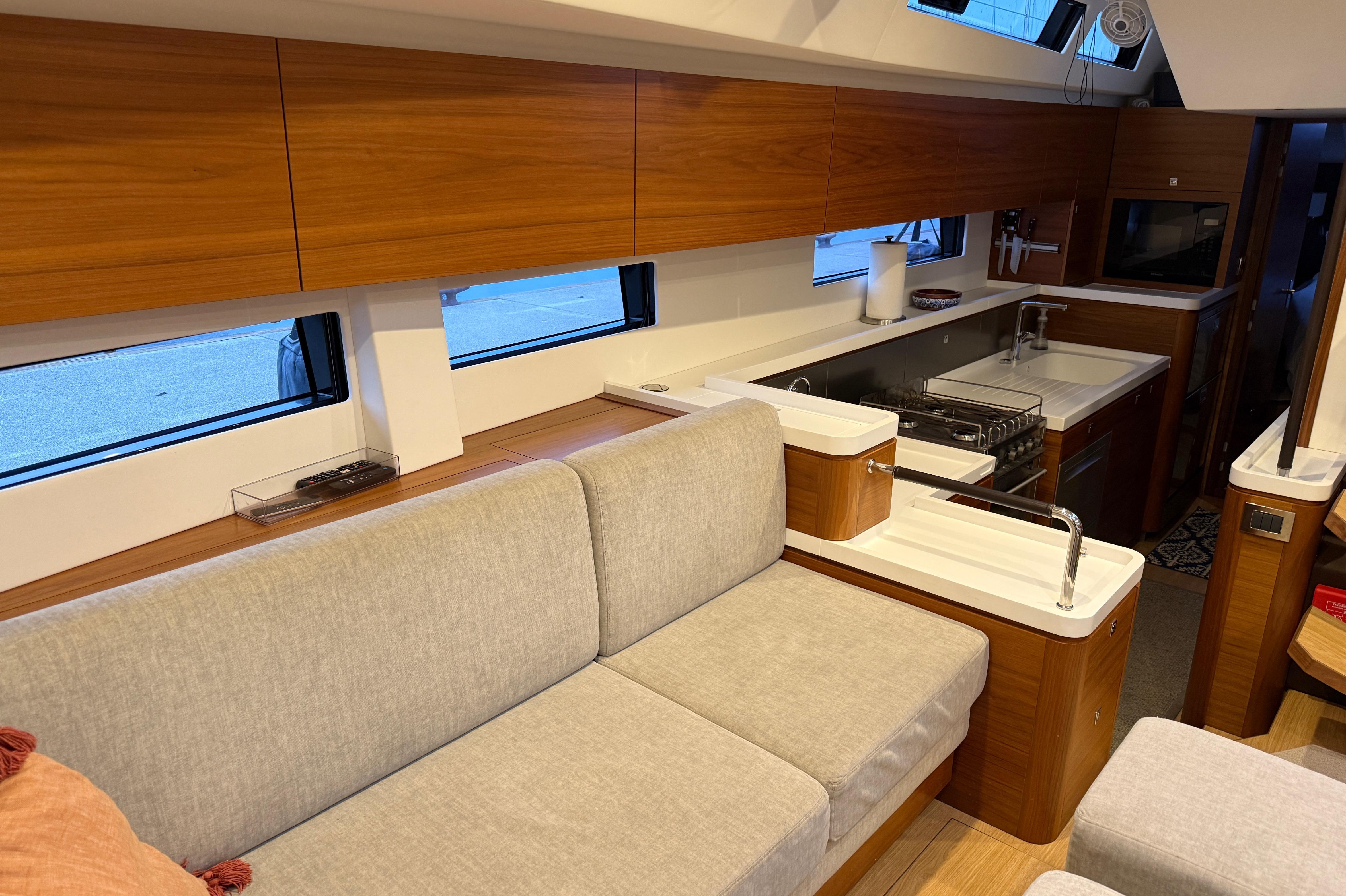 Modern interior of 2020 Amel 50 yacht with sleek kitchen and comfortable seating.