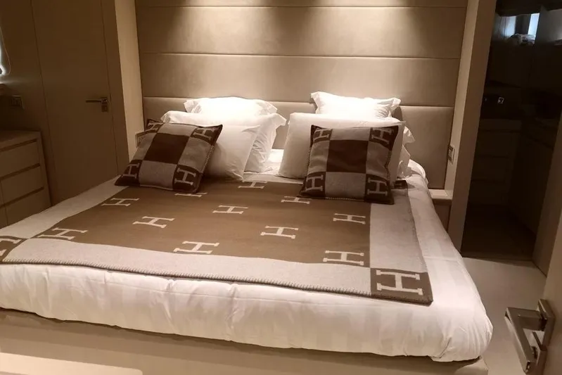  Yacht Photos Pics Luxurious bedroom interior on 2011 Sanlorenzo 72 yacht, featuring elegant bedding and plush pillows.