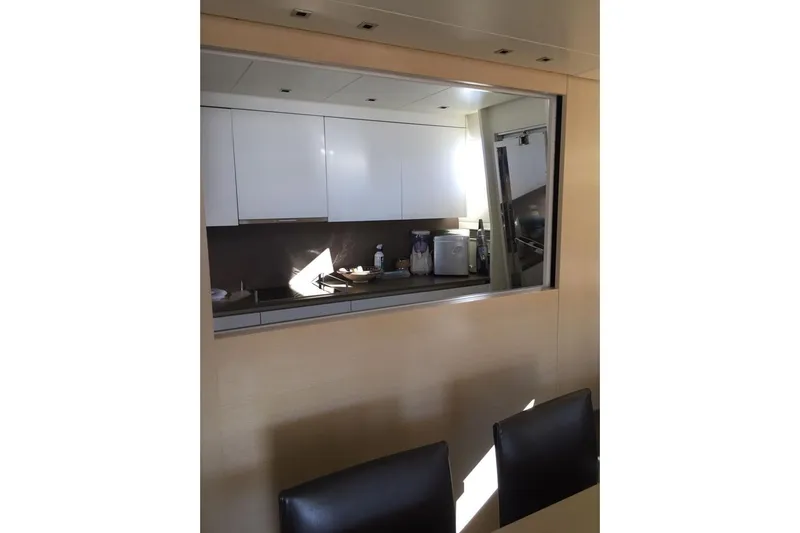  Yacht Photos Pics Modern kitchen interior on 2011 Sanlorenzo 72 yacht, featuring sleek cabinetry and appliances.