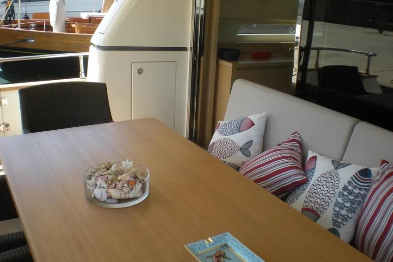  Yacht Photos Pics Luxurious Sanlorenzo 72 yacht interior with decorative pillows and elegant dining table, 2011 model.