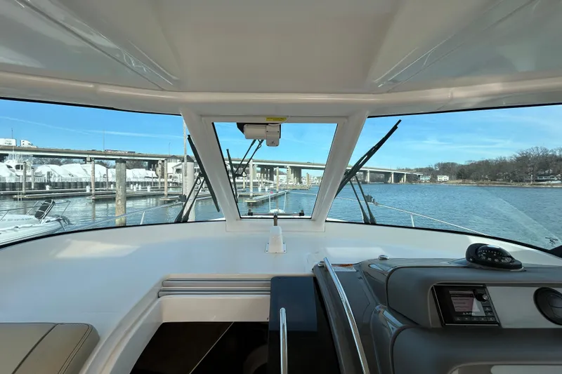  Yacht Photos Pics 2018 Pursuit OS 385 Offshore boat interior with bridge view and navigation equipment.